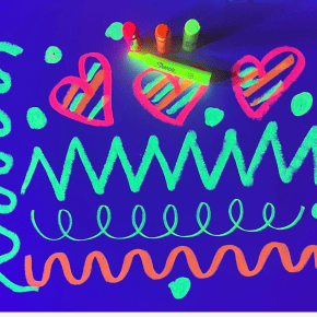 Hearts, zig zags, and swirly lines are drawn with neon tempera sticks and highlighters on white paper, glowing under a black light